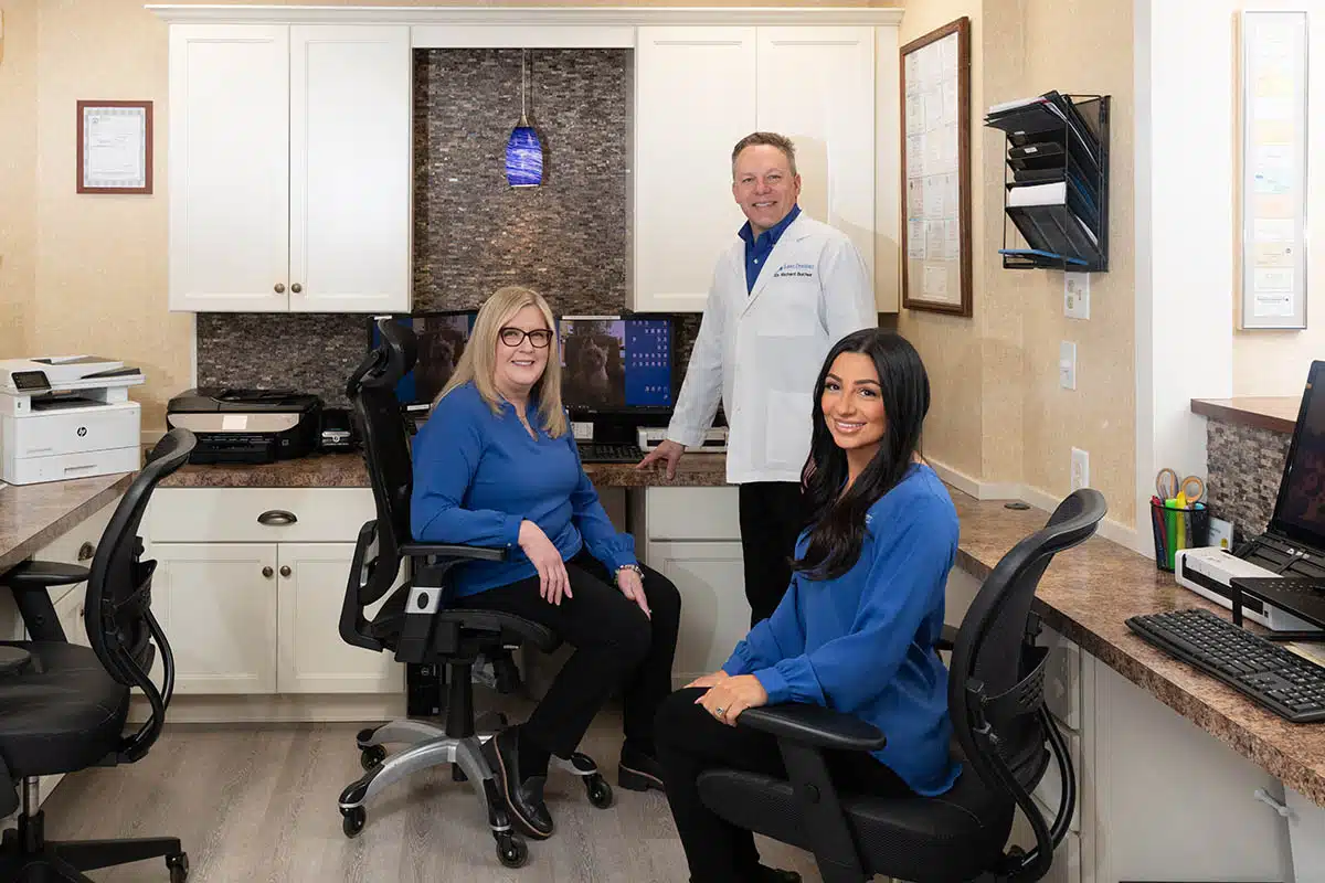 Smiling woman receiving laser cavity treatment in Oakland, NJ