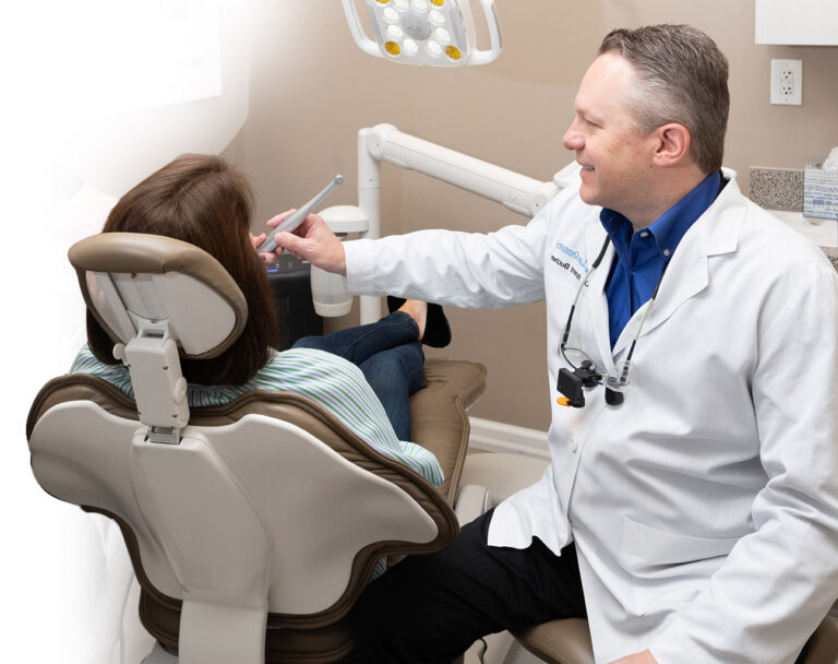 Dentist performing laser deep teeth cleaning in Oakland, NJ